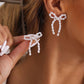 Pearl bow tie earrings
